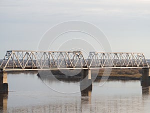 Railway bridge through the river