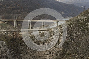 A railway bridge with trains passing over Tsonevo dam.