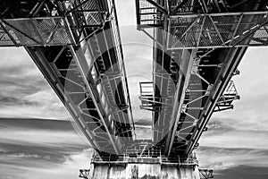 Railway bridge under cloudy sky