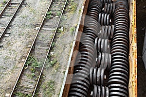 Railway carriage loaded with new train wheels