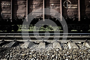 Railway carriage on rails, moving, blured by low shutter speed.