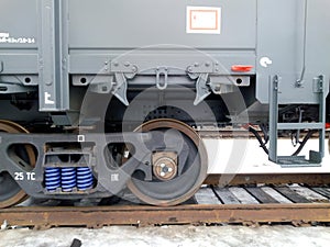 A railway carriage stands on rails