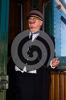 Railway conductor at departure