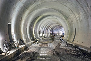 Railway corridor construction. Arch in lighted tunnel