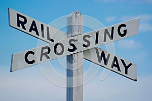Railway crossing sign in white photo
