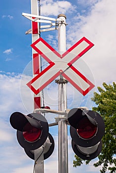 Railway crossing signals and barrier