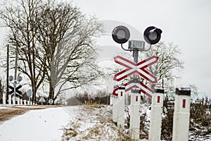 Railway crossing with signs and rails