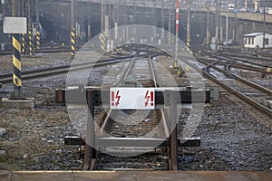 Railway deadlock with a white sign. Concept: travel is prohibited, end of the road