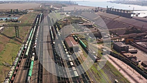 Railway depot with many cargo trains in a sea port.