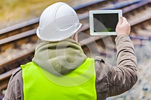 Railway engineer filmed rails with tablet PC