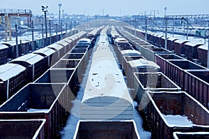 railway freight trains and wagons. rail cargos. rail transportation. railway freight station in gloomy winter day photo