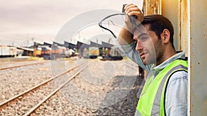 Railway Industry Engineer standing beside the Freight Train