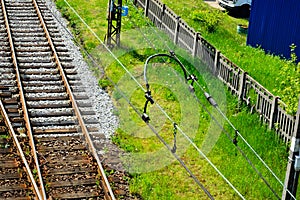 Railway infrastructure on a summer day. Tracks, rails, wires and semaphores.