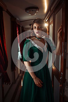 Railway journey woman in vintage train compartment
