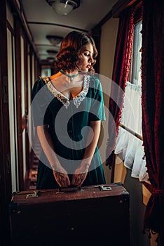 Railway journey woman in vintage train compartment