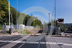 Railway level crossing with barriers and traffic lights