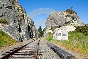 Railway lines through gorge, between large rock outcrops past old disused Frog Rock Station