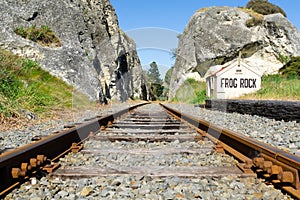 Railway lines through gorge, between large rock outcrops past old disused Frog Rock Station