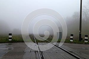 The railway pathing deep in fog