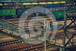 Railway platform, a freight train with containers.