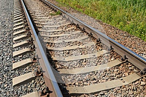 Railway rails on a grass.