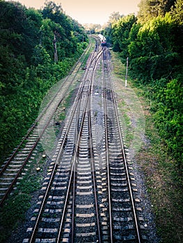 Railway rails with a leaving train. Railway rails
