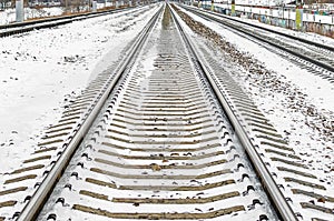 Railway rails sleepers away snow in winter