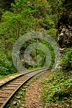 The railway runs through the rocks and mountains