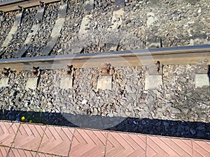 Railway section with rails and sleepers close-up