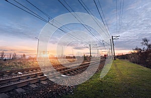 Railway station against beautiful sunny sky. Industrial landscape