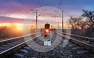 Railway station against beautiful sunny sky. Industrial landscape