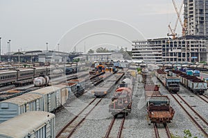 Railway station. Freight old cars and tanks on the railway. Train at the station. Rail transport.