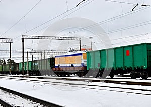 Railway station, freight train wagons, trolley bus on a railway platform. Logistics of delivery of the truck,