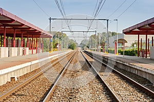 Railway station with two tracks and electric power.