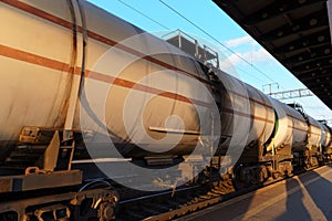 railway tank cars, railroad station platform, concept of freight transportation by rail, industrial cargo transport