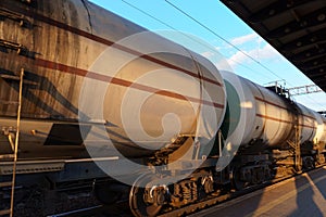 railway tank cars, station platform, concept of freight transportation by rail, industrial cargo transport