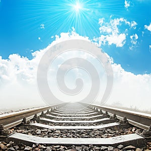 Railway to heaven in clouds and sun