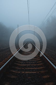 Railway to horizon in fog