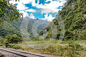 Railway to Machu Pichhu inca citadel and peruvian mountains at sunny day