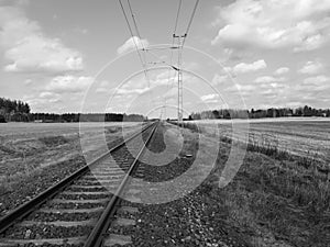 Railway track through fields