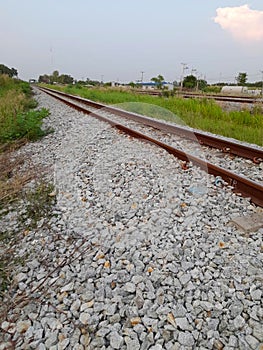 Railway track on an old city street. the way to the end of an early morning. the background