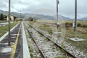 Railway track at Palena station on upland near Forchetta pass, Abruzzo, Italy photo