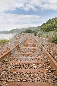 Railway track running along the shore of the Firth of Forth.