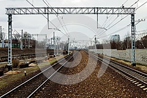 The railway track with steel rails and railroad infrastructure