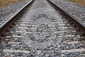 Railway tracks disappearing into the horizon. Concept of means of transport