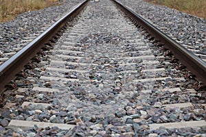 Railway tracks disappearing into the horizon. Concept of means of transport