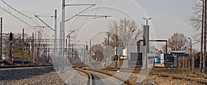 Railway tracks and railway infrastructure against the background of a winter, sunny sky. photo
