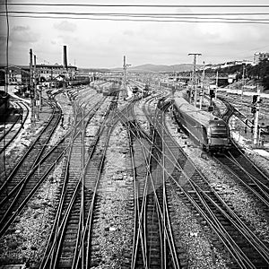 Railway tracks leading to industrial complex