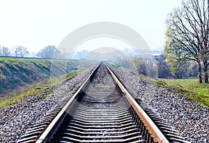 railway tracks on the outskirts of the city in the early morning