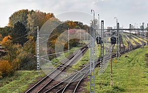 Railway tracks at the station, autumn landscape